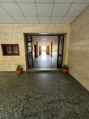 an empty hallway of an office building with potted plants at Silihome, Trastevere, Piazza della Radio in Rome