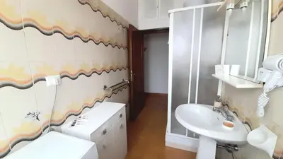 a bathroom with a sink and a toilet at VIVA Rome Apartment 