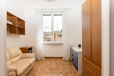 a living room with a couch and a window at VIVA Rome Apartment 