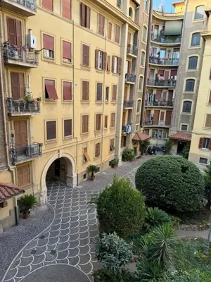 an empty street in front of a building at Domus Urbani in Rome