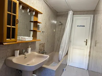 a bathroom with a sink and a shower at Domus Urbani in Rome