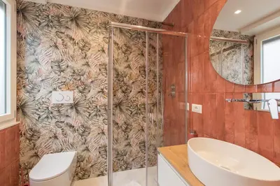 a bathroom with a shower with a toilet and a sink at INTERNO 10 - Musei Vaticani in Rome