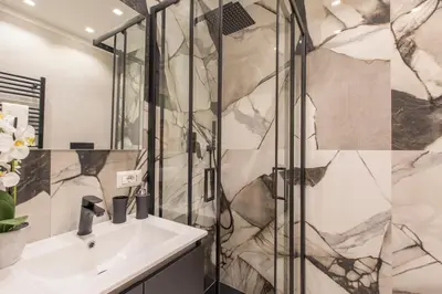 a bathroom with a shower and a sink at INTERNO 10 - Musei Vaticani in Rome