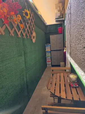 a room with a bench and a green wall at Simone's apartment in Rome