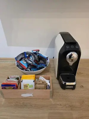 a toaster sitting on a table next to a box at Simone's apartment in Rome