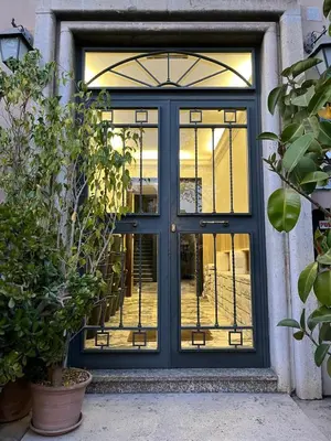 a front door with a blue door at Colosseo Rooms Rome in Rome