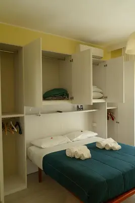 a bedroom with a bed with two towels on it at CasaLetizia A Roma con piacere! in Rome