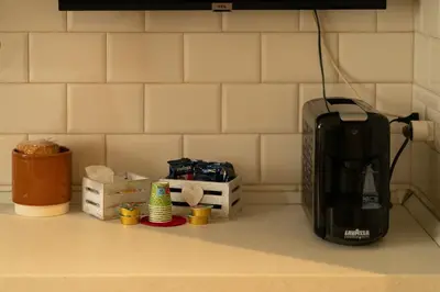 a toaster sitting on top of a kitchen counter at CasaLetizia A Roma con piacere! in Rome