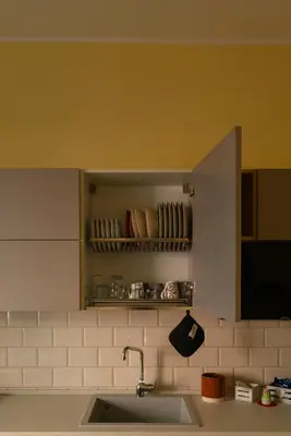 a kitchen with a sink and a shelf with cups at CasaLetizia A Roma con piacere! in Rome
