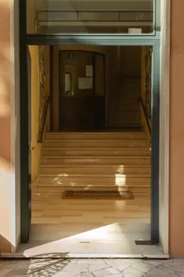 an open door to a stairwell with a set of stairs at CasaLetizia A Roma con piacere! in Rome