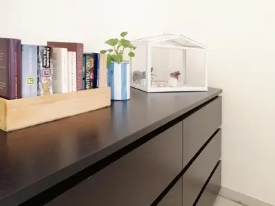 a shelf with a fish tank on top of a dresser at Appiano Vatican city, lovely apartment, 2 room ,Wi-fi 250 mbps in Rome