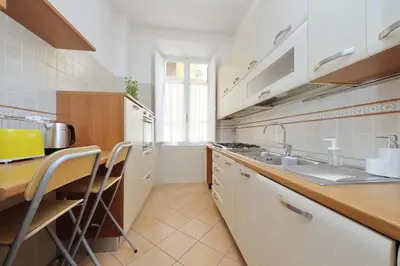 a kitchen with a sink and a counter top at 4BNB - Vittorio Emanuele Apartment in Rome