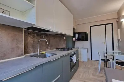 a kitchen with a sink and a counter top at Vatican 6th floor Suite AC Panoramic views in Rome