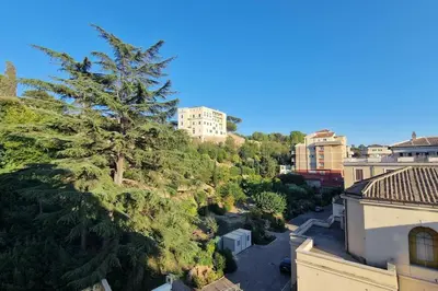 an aerial view of a city with a tree at Vatican 6th floor Suite AC Panoramic views in Rome
