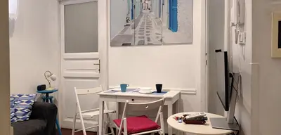 a small room with a white table and chairs at Trasteverino in Rome