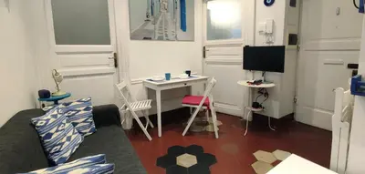 a small room with a desk and a television at Trasteverino in Rome