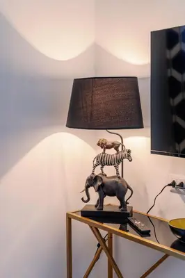 a lamp with a skeleton riding an elephant on a table at Roma Centro Holiday House in Rome