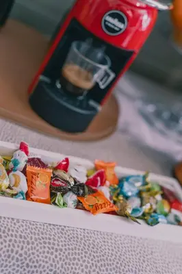 a container of candy in front of a blender at AMA Roma 5 minuti dal Colosseo in Rome