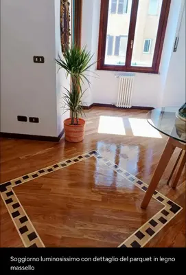 a room with a glass table and a potted plant at Testaccio Artistic Home - Centro Storico Roma - RIONI DI ROMA in Rome