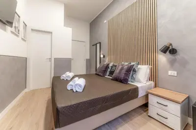 a bedroom with a bed with towels on it at Bello Urban Boutique - Golden Keys Collection in Rome