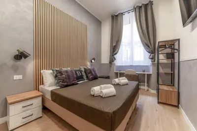 a bedroom with a bed with towels on it at Bello Urban Boutique - Golden Keys Collection in Rome