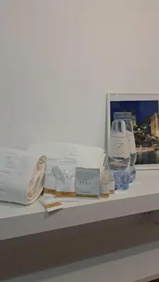 a shelf with towels and other products on it at Domus Provinciae in Rome