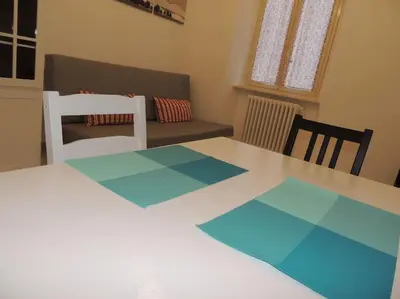 a living room with a table and a couch at Apt Central Magenta in Rome