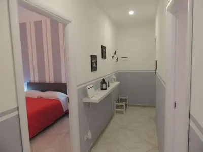 a bedroom with a bed and a sink in a room at Apt Central Magenta in Rome
