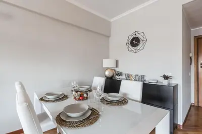 a bedroom with a bed and a glass table at Elegant Hideaway Steps from St Peter in Rome