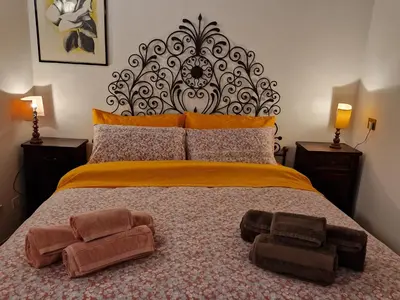 a bedroom with a bed with two towels on it at Simple life in Rome in Rome