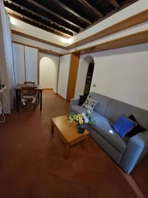 a living room with a couch and a table at Simple life in Rome in Rome