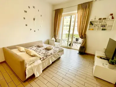 a bedroom with a bed in a room with a window at Domus Laterani by JFM - Comfortable apartment big terrace Colosseo in Rome