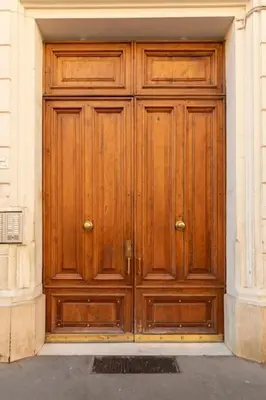 a large wooden door on the side of a building at Domus Romana Musei Vaticani in Rome