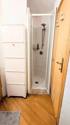 a bathroom with a shower with a glass door at Cozy Home in San Cosimato in Rome