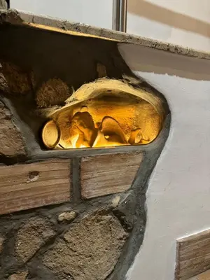 a stone oven with some food inside of it at Al 25 Trastevere, Roma in Rome