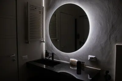 a bathroom with a sink and a mirror at Maison Chic Spagna in Rome