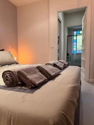 a bedroom with a bed with towels on it at Maison Chic Spagna Two in Rome