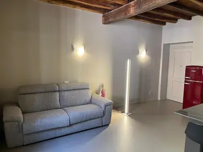 a living room with a couch and a refrigerator at Maison Chic Spagna Two in Rome