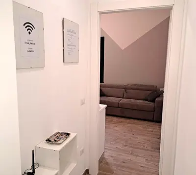 a living room with a couch and a table at San Giovanni Metro Flat in Rome