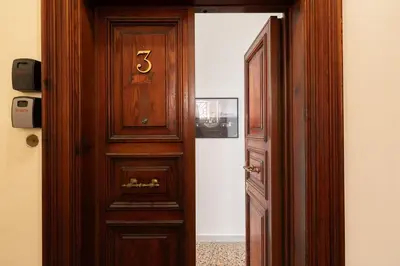 a wooden door with the number five on it at Rétro Chic Circo Massimo in Rome