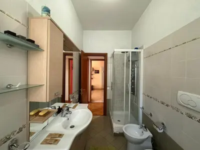 a bathroom with a sink and a toilet at Hidden Gem in Magliana in Rome