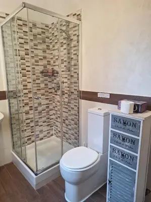 a bathroom with a toilet and a shower at Roma Trastevere Holiday in Rome
