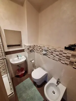 a bathroom with a toilet and a sink at Roma Trastevere Holiday in Rome