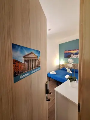 a room with a room with a bed and a door at Roma Trastevere Holiday in Rome