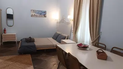 a small room with a bed and a table at loft a Castel S Angelo A e B in Rome