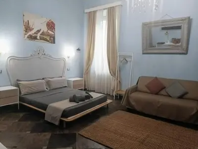 a living room with a bed and a couch at loft a Castel S Angelo A e B in Rome