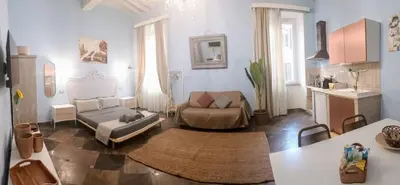 a living room with a couch and a table at loft a Castel S Angelo A e B in Rome