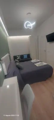 a bedroom with a large bed in a room at Bemy in Rome