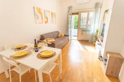 a living room with a white table and a couch at 