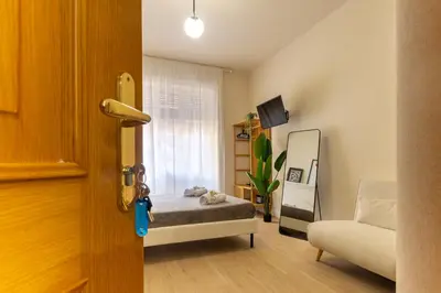 a small bedroom with a bed and a window at Aureum Angelicum in Rome